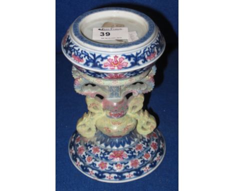 Chinese porcelain candle or lamp stand overall decorated in under glazed blue with foliate designs and poly chrome devices on