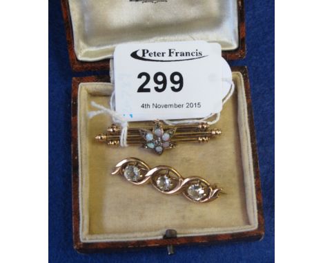 Yellow metal opal and diamond bar brooch, and another three stone bar brooch.  Boxed.