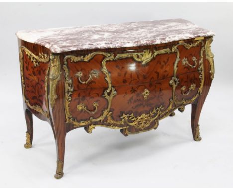 A Louis XV style kingwood floral inlaid and ormolu mounted bombe shaped commode, with serpentine marble top above two drawers