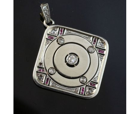 A 1930's/1940's gold and white metal, ruby and diamond pendant, of diamond shape and set with old and rose cut diamonds and s