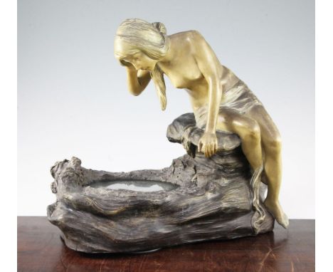 An Austrian Art Nouveau painted terracotta figural lamp, modelled as a young maiden looking into a rock pool, compressed mark