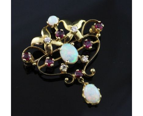 A 1970's Art Nouveau style 18ct gold, white opal, ruby and diamond set open scrollwork pendant brooch, maker, PSR, London, 19