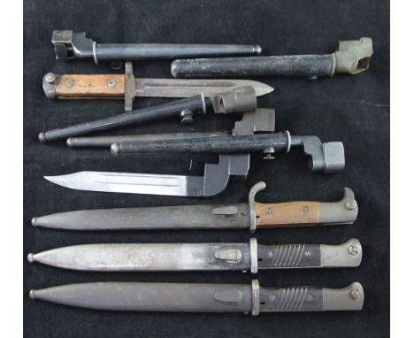 A German WWII K98 bayonet, by Euf Horster, with 10 inch blade and steel scabbard, together with another similar K98 bayonet, 