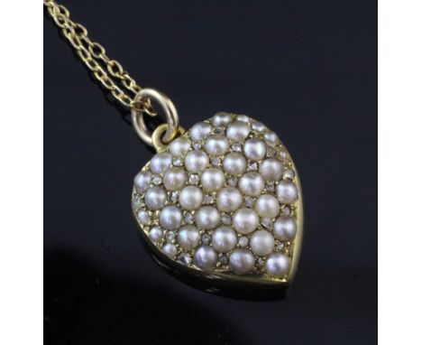 A Victorian 15ct gold, split pearl and diamond set heart shaped pendant locket, pendant (glazed panel missing), on a unmarked