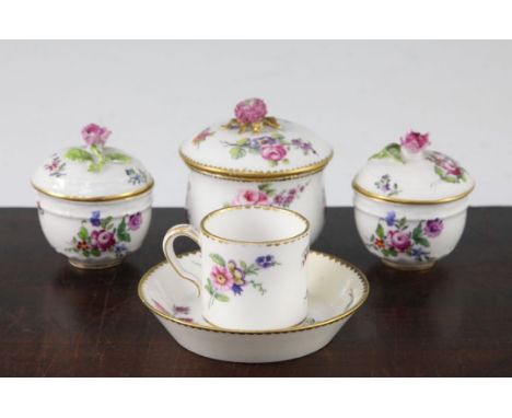 A Sevres sucrier and cover and a similar coffee can and saucer, c.1766, each painted with flower bouquets, the sucrier with t