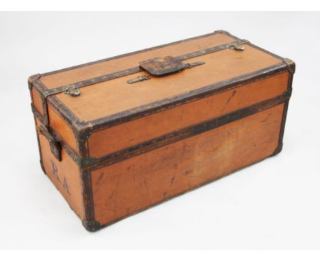 An early 20th century Louis Vuitton cabin trunk, with double hinged top revealing a compartmented interior, with central bras