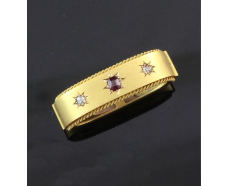 A late Victorian 15ct gold, ruby and diamond set scarf clip, in original box, gross 7.6 grams, approx. 1.25in.