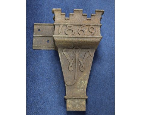 A Victorian gothic cast iron rain hopper, dated 1869, with the monogram JW