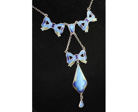 A mid 20th century? silver and guilloche enamel pendant drop necklace, with three ribbon bow motifs and teardrop shaped drop,