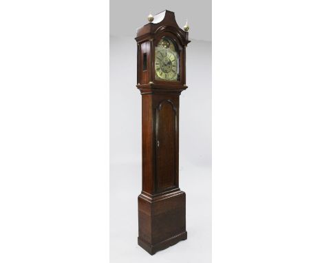 Thomas Jackson of London. A George III oak eight day longcase clock, the 12 inch arched brass dial with subsidiary seconds an