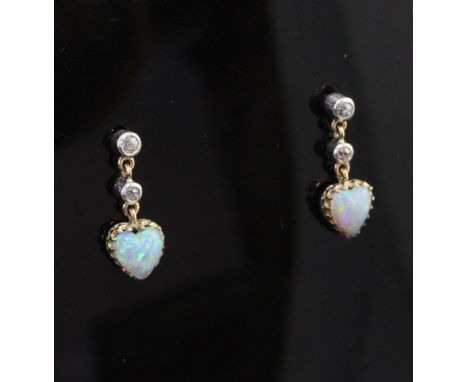 A pair of Edwardian gold, white opal and diamond drop earrings, each set with a heart shaped opal and two round cut diamonds,