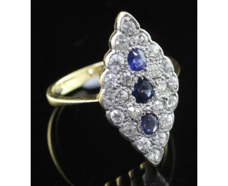 A 1940's 18ct gold sapphire and diamond marquise shaped ring, set with old cut diamonds and round and oval cut sapphires, siz