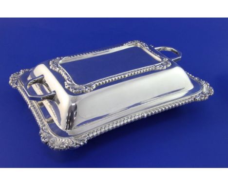 A 1940's silver entree dish and cover, with gadrooned borders and shell, scroll corners, Gladwin Ltd, Sheffield, 1947, 10.75i