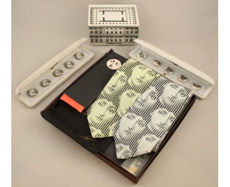 A collection of Fornasetti: An Architettura pattern box and cover, 13.5cm. two sets of five cased porcelain buttons, two silk