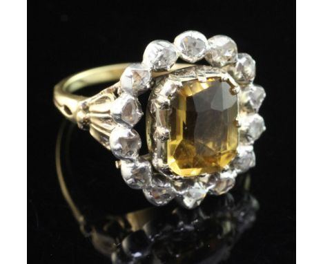 A 19th century style gold, citrine and rose cut diamond set cluster ring, the central emerald cut citrine weighing 2.65ct (ad