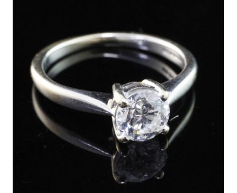 An 18ct white gold and solitaire diamond ring, the round brilliant cut stone weighing approximately 0.75ct, size J.