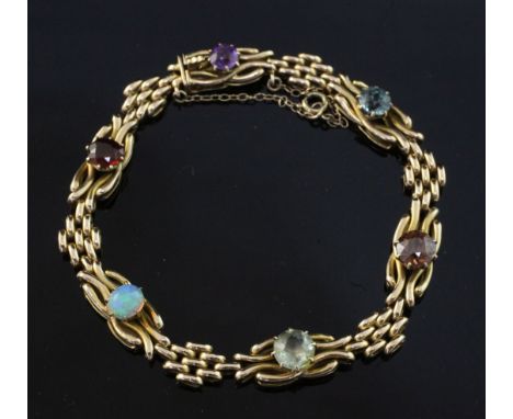 An Edwardian 15ct gold and multi gem set bracelet, including white opal, amethyst and zircon, gross weight 14 grams, approx. 