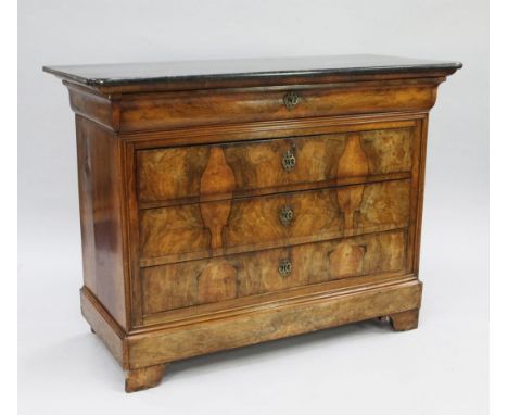 A 19th century French marble top walnut commode, fitted with four long drawers, on bracket feet, W.4ft 4in.