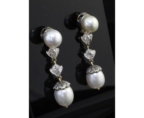 A pair of Victorian style cultured pearl and diamond drop earrings, each set with two pearls, two diamonds and rose cut diamo