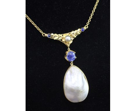 A high carat gold, baroque mabe pearl and sapphire set pendant necklace, with pierced foliate suspension bar, pendant 2in.