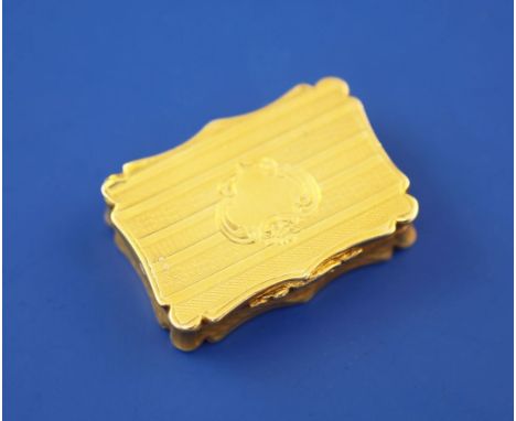 A Victorian silver gilt vinaigrette by Nathaniel Mills, of shaped rectangular form, with engine turned decoration and vacant 