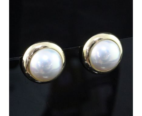 A pair of Tiffany & Co 14ct gold and mabe pearl ear clips, of circular form, in Tiffany & Co box, approx. 0.75in.