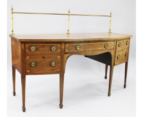 A George III inlaid mahogany and satinwood crossbanded bowfront sideboard, inlaid with marquetry shells and corner fan motifs