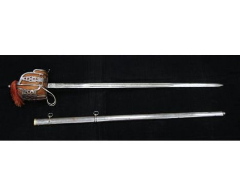 An early 20th century Scottish basket hilt broad sword, with 32 inch etched blade and steel scabbard, overall 40.5in.