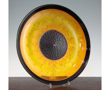 A Murano glass dish, by Cenedese, c.1960's, the ruby flecked amber glass dish with applied ruby rim and wheel engraved sculpt