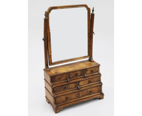 A Queen Anne style walnut dressing table mirror, fitted with an arrangement of six graduated drawers, on bracket feet, H.2ft 