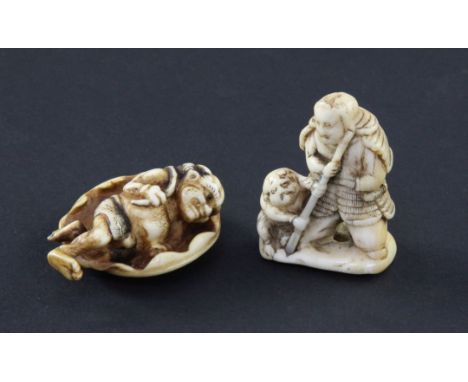 Two Japanese ivory netsuke, 19th century, the first depicting a samurai and a figure crouched at his feet, 4cm, the second an