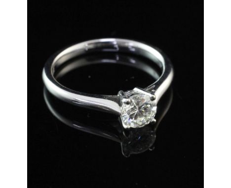 An 18ct white gold and solitaire diamond ring, the round brilliant cut stone weighing approximately 0.50ct, size K.
