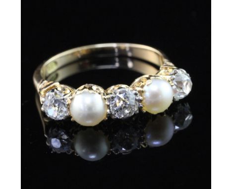 An 18ct gold, split pearl and diamond five stone half hoop ring, with scroll setting, size O.