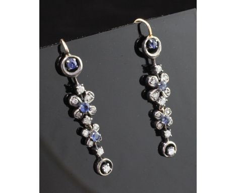 A pair of Edwardian gold and silver, sapphire and diamond set drop earrings, with graduated foliate and circular drops, 1.5in