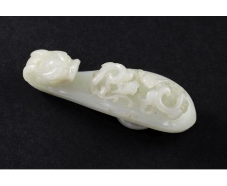 A Chinese white jade 'dragon' belt hook, 18th century, carved in openwork with two scrolling chi-dragons, with a dragon-head 