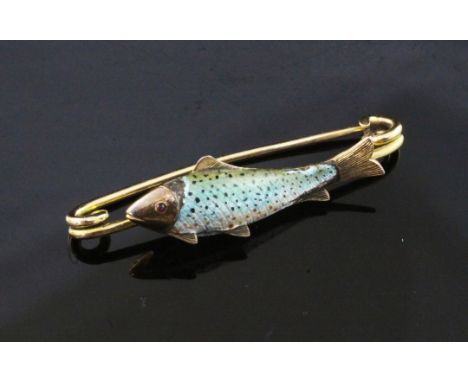 A late Victorian 15ct gold and enamel fishing related brooch, modelled as a trout, 1.75in.