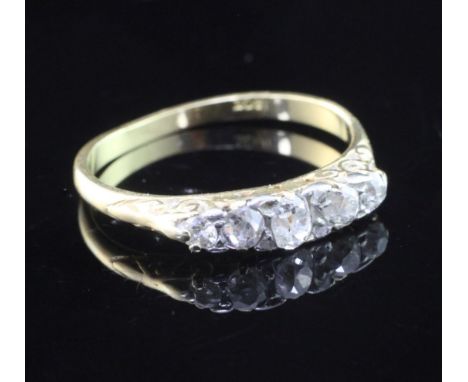 A 18ct gold and graduated five stone diamond ring, size M.