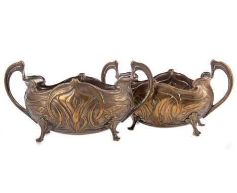 PAIR OF ART NOUVEAU SILVER PLATED SWEETMEAT BOWLS,each of oval form, embossed with stylised foliage and lily heads, with twin