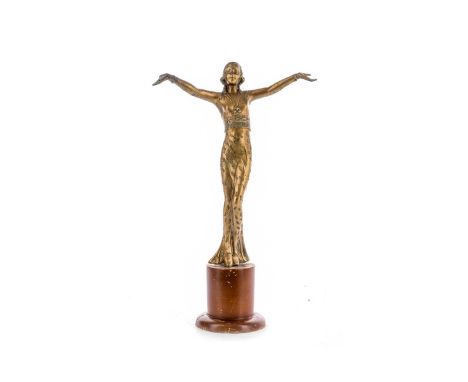 FRENCH ART DECO GILT METAL FIGURE,modelled as a flapper in slim-fitting dress, on stained socle base, 36.3cm high