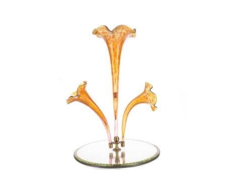 EARLY 20TH CENTURY IRIDESCENT GLASS EPERGNE,with three mottled glass trumpets issuing from a mirrored circular base with scal