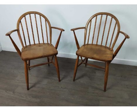 PAIR OF ERCOL ELM AND BEECH WINDSOR ARMCHAIRS,c.1970, each with a paper Ercol label and stamped F182, 84cm high (2)