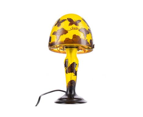 CAMEO GLASS MUSHROOM TABLE LAMP IN THE MANNER OF GALLÉ,with butterflies amongst floral blooms against a yellow ground, bearin