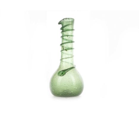 CLUTHA GLASS BY JAMES COUPER &amp; SONS OF GLASGOW (1850-1922),a green oil flask or carafe with trailed spiral to neck and sh