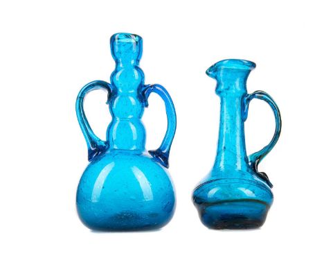 CLUTHA GLASS BY JAMES COUPER &amp; SONS OF GLASGOW (1850-1922),a blue twin handled bottle vase, 17cm high, together with an o