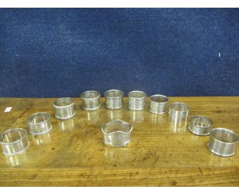 A collection of silver napkin rings, 325g (11 in total)Location: Cab 