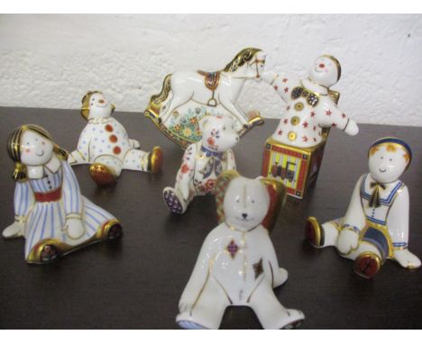 Seven Royal Crown Derby models to include two rag dolls, two clowns, a teddy, a rabbit and a rocking horse together with two 