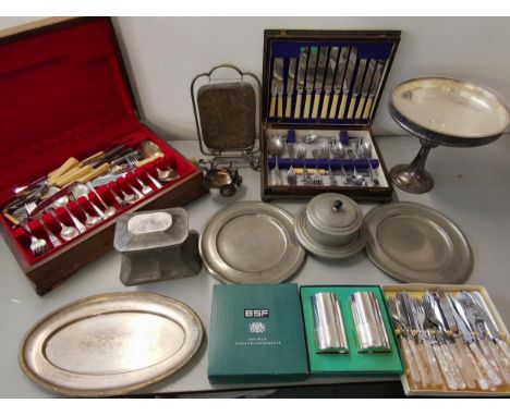 Silver plate to include two canteens of cutlery, a tazza with glass liner, a Skinner & Co tea caddy, a Burmese gong on plated