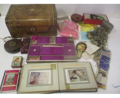 Collectables to include an 1877 calendar, vintage stockings, pin cushions, Victorian album and other items contained in a wal