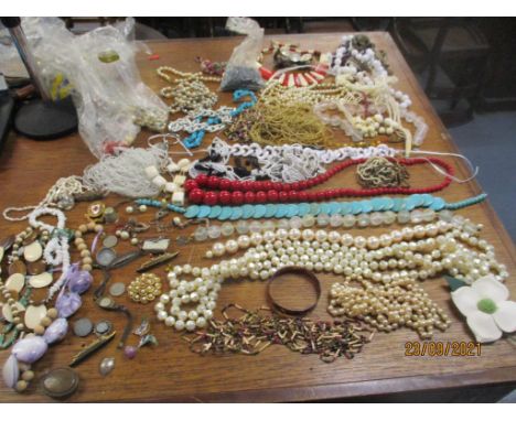 A mixed lot of costume jewellery to include beaded necklaces, a brass cased Elbon ladies wristwatch, silver brooches and othe