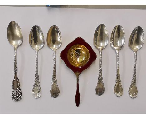 A Norwegian silver gilt and enamel tea strainer, together with a set of five sterling silver spoons and one other, 142g, Loca